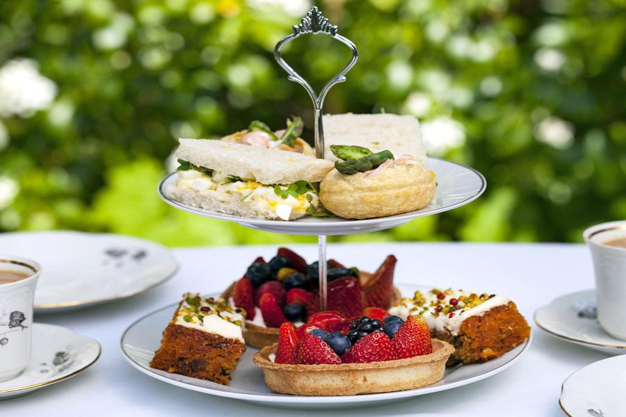 Delicious cakes and sandwiches on a cake stand St George's Hotel Care Home